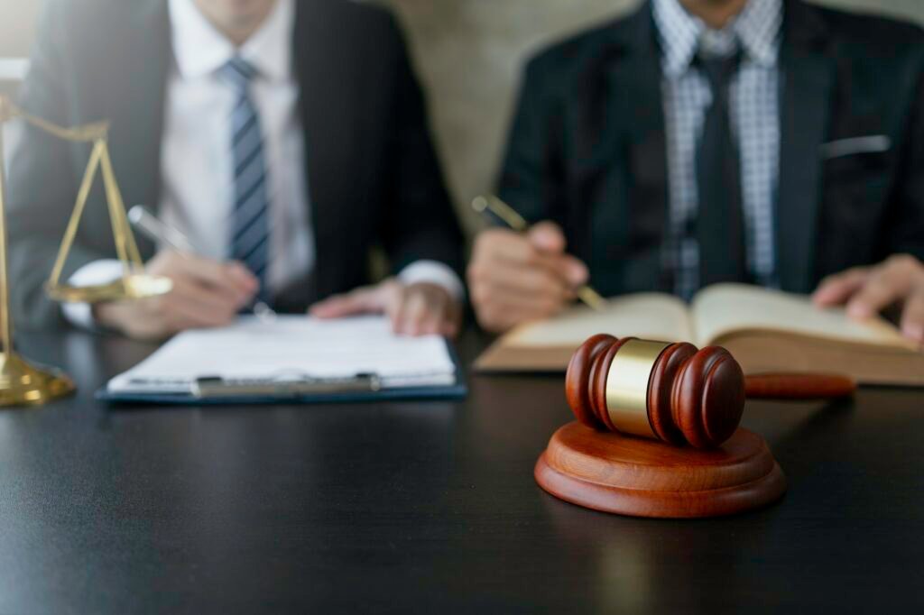 Attorney or judge provides legal advice to clients in the courtroom including the impartiality of th